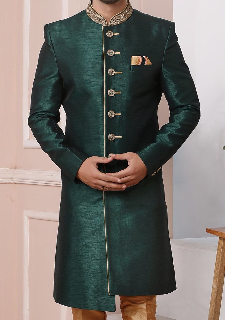 Ready-Made Sherwani With Trouser. Art Banarasi Fabric Top. Art Dupion Aligarhi Ready Made Trouser. Crafted in Chinese Collar Neck, and Full Sleeve. Faux Satin Lining with Plain Work. High-Quality Matching Buttons. Please Note: The footwear shown in the picture is for presentation and photography purpose only. Color: There might be slight color variation due to lightings and flashes while photo shooting. The color may also vary because of different screen resolutions. Wash Care: Dry Clean Only. Green Nehru Jacket With Zari Work For Diwali, Green Sherwani With Zari Work, Straight Kurta Style, Green Sherwani With Zari Work Straight Kurta, Green Sherwani With Zari Work, Green Semi-stitched Bandhgala With Resham Embroidery, Fitted Bandhgala For Festive Occasions Like Diwali, Formal Gold Kurta With Cutdana Detailing, Gold Kurta With Cutdana For Formal Occasions, Bollywood Style Green Nehru Jacket With Zari Work