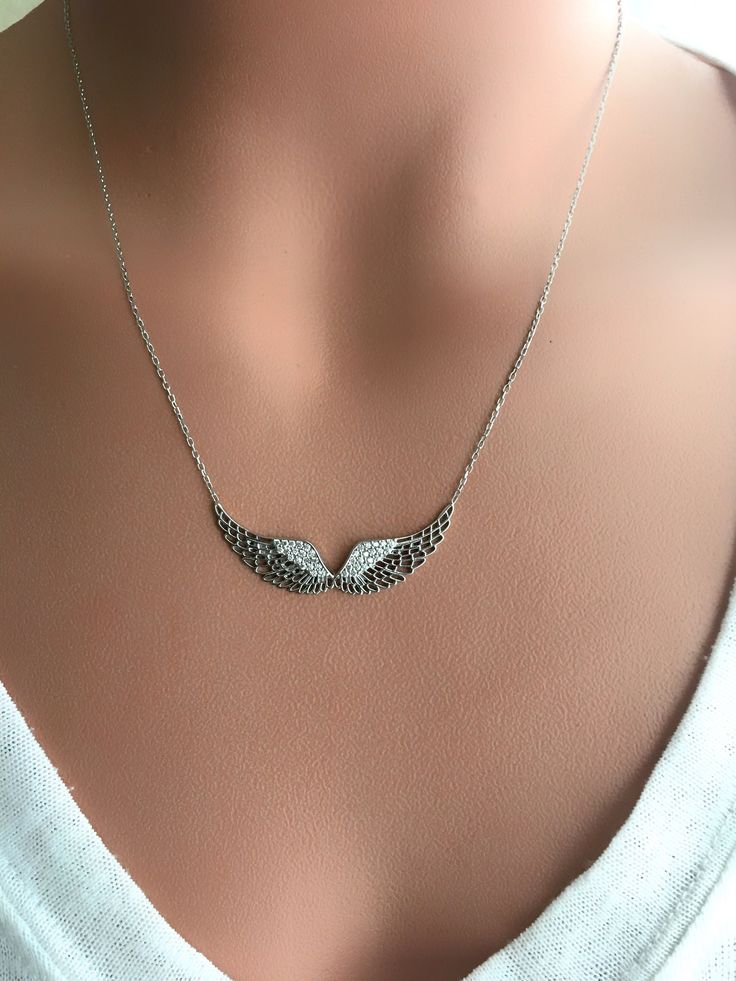 Silver: 925 sterling silver Stone: Zircon Pendant size: 4 cm-1 cm 📌 All the metal components are solid .925 STERLING SILVER (not plated). 📌I have many styles of jewelry in my shop. I invite you to take a look at my entire collection. https://www.etsy.com/shop/ArtJewelrybyHilal 📌You can browse the following link for different necklace models. https://www.etsy.com/shop/ArtJewelrybyHilal?ref=search_shop_redirect§ion_id=24205018 💌We're happy to answer any questions. Please contact us! Thanks Hil Silver Diamond-cut Necklace, Fine Jewelry Silver Diamond Pendant Necklace, Silver Pendant Diamond Necklace In Fine Jewelry Style, Silver Diamond Pendant Necklace In Fine Jewelry Style, Elegant Silver Wing-shaped Necklace, White Gold Sterling Silver Diamond Pendant Necklace, Diamond Jewelry With Silver Chain For Gift, Diamond White Engraved Pendant Necklace, Engraved Sterling Silver Necklace In Diamond White