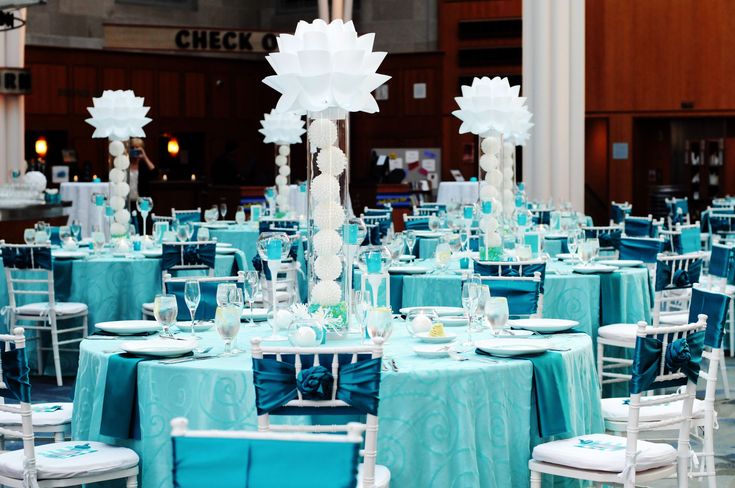 four different shots of a table setting with flowers in vases and napkins on the tables