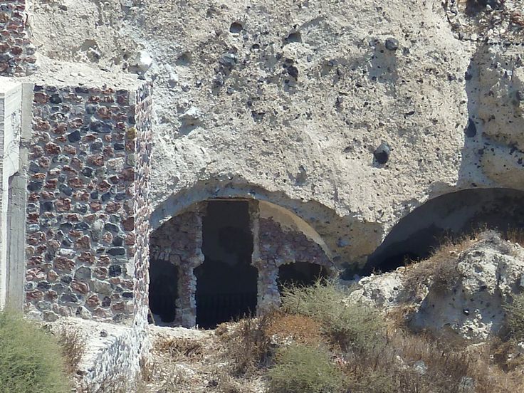 an old stone building with two small doorways