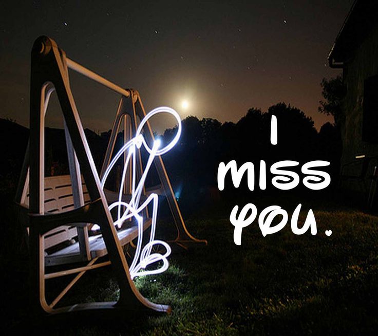 an illuminated swing in the grass with text that reads, share if you miss someone i miss you