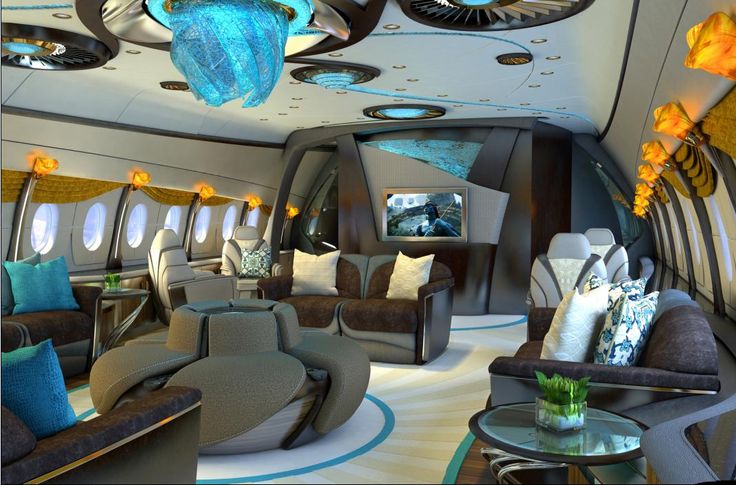 the inside of an airplane with couches, chairs and lamps on it's ceiling