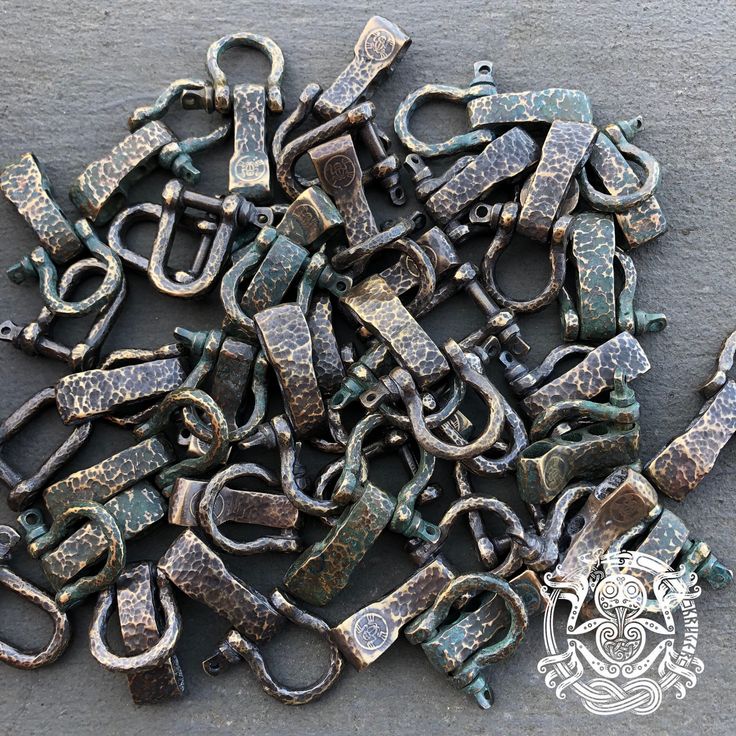 an assortment of old metal objects on the ground