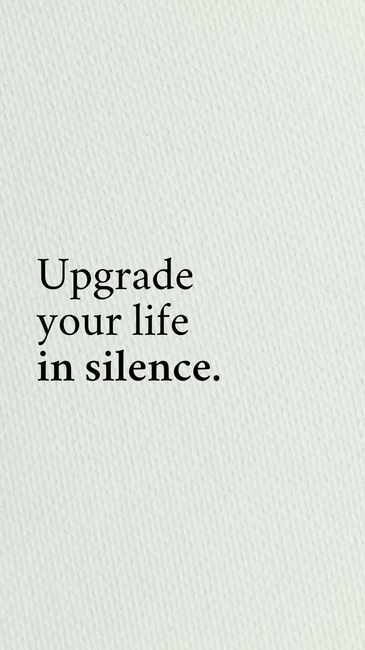 the words upgrade your life in silence are written on a white paper with black lettering