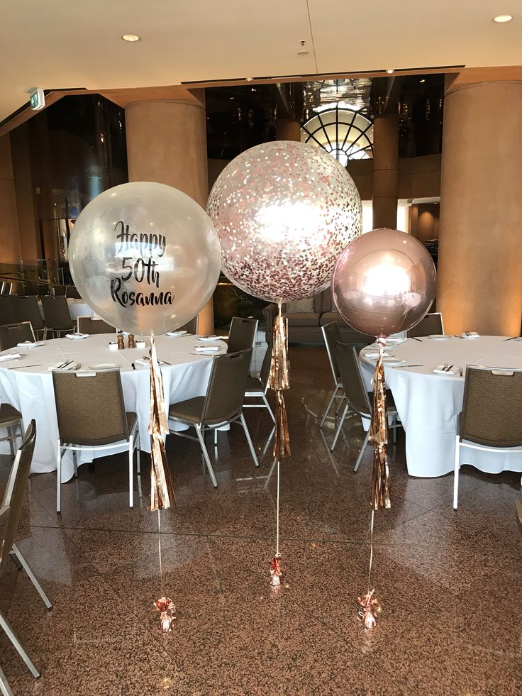 balloons and streamers in the middle of a banquet room