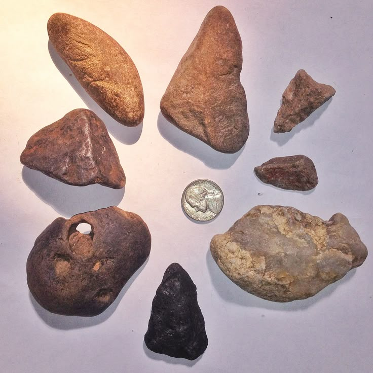 some rocks and a dime on a table