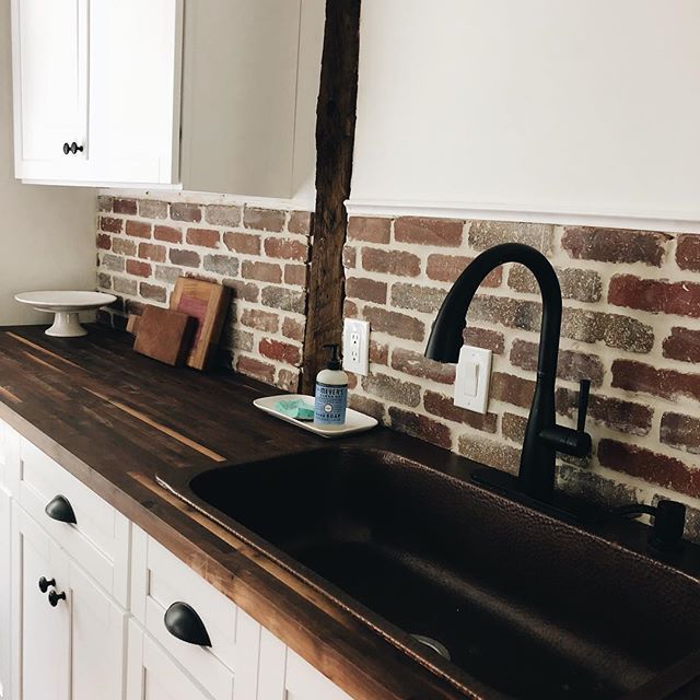 butcher block countertop brick backsplash kitchen Butcher block