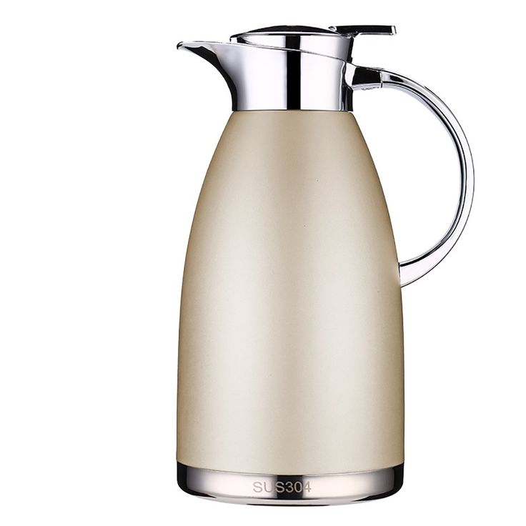 a cream colored electric kettle with a stainless steel handle