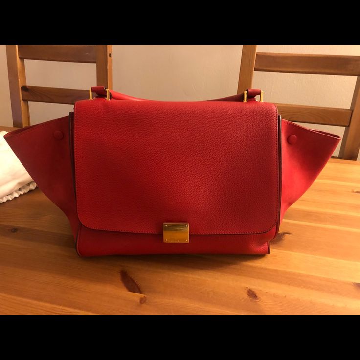 In Great Condition. Comes With Dust Bag. High-end Red Top Handle Satchel, High-end Red Satchel Tote, High-end Red Shoulder Bag For Office, High-end Red Satchel, Luxury Red Office Bags, Red Satchel With Gold-tone Hardware Modern Style, High-end Red Bag With Removable Pouch, Modern Red Satchel With Gold-tone Hardware, High-end Red Shoulder Bag With Double Handle