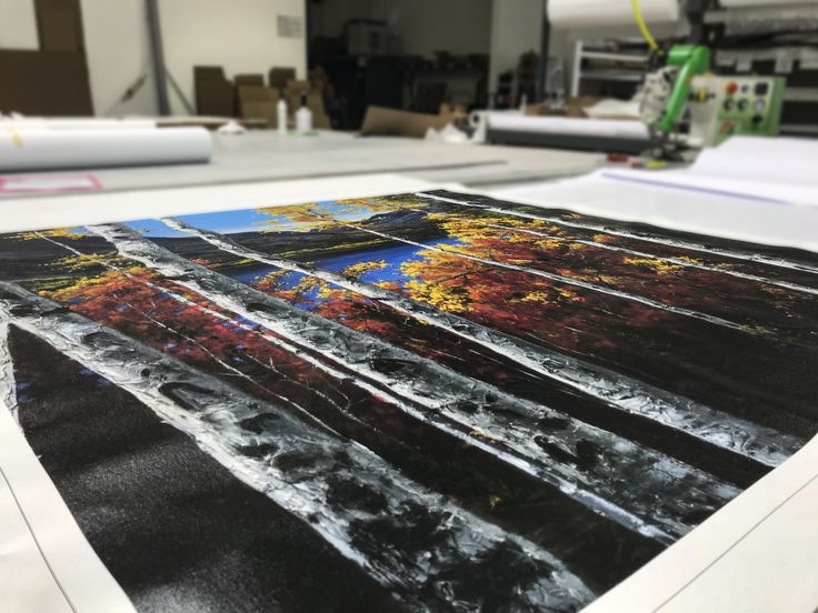 an image is being printed onto a large sheet of paper