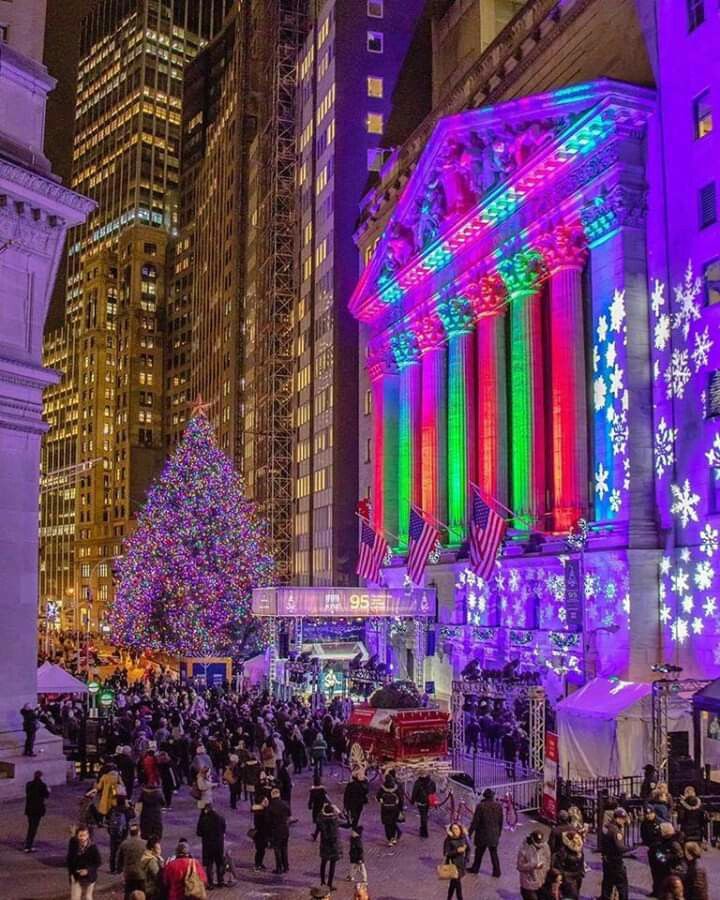 the christmas tree is lit up with colorful lights