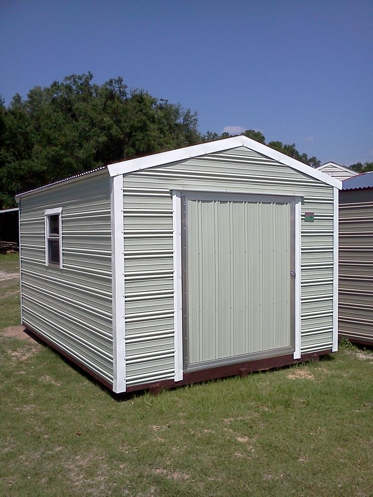 two garages side by side in the grass