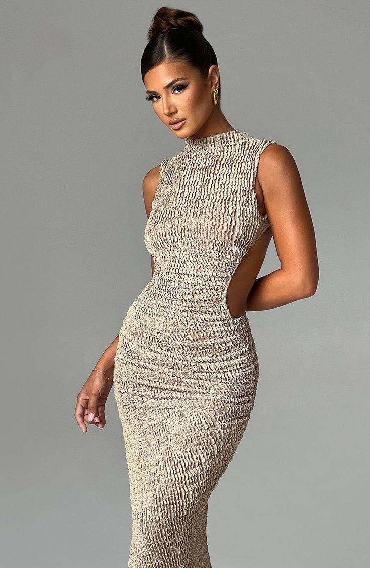 Crafted in our textured stretch fabric that hugs every curve, the Aphrodite midi features an asymmetric skirt with thigh high split. The high neck design is complete with a showstopping open back detail. Style yours with heeled mules and sleek waves. 



Colour: Beige.

Textured stretch fabric.



Open low back.

Asymmetric skirt.

Thigh high split.

Button closure at back neck.

High neck.

Midi length.

Model is an XS and is wearing an XS.

 Size: XS, S, M, L, XL, XXL Luxury Sheer Midi Dress For Evening, Luxury Sheer Midi Dress For Formal Events, Luxury Sheer Midi Dress For Formal Occasions, Luxury Asymmetrical Midi Dress For Night Out, Luxury Asymmetrical Neckline Bodycon Cocktail Dress, Luxury Sheer Bodycon Dress For Party, Luxury Midi Halter Neck Dress With Back Opening, Luxury Sheer Bodycon Dress, Luxury Backless Midi Dress With Ruched Back