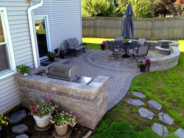 an outdoor patio with seating and fire pit