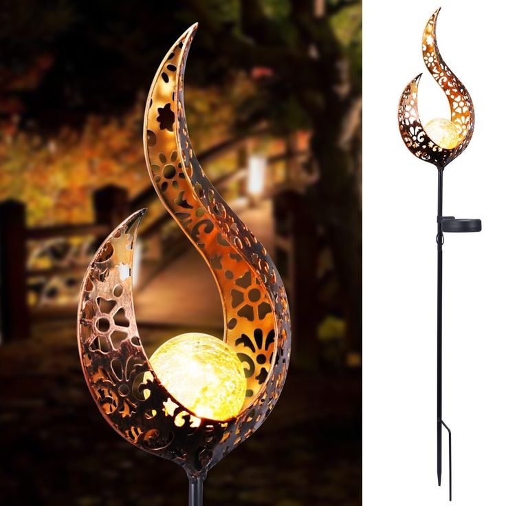 an outdoor lamp that is shaped like a flower and has a spiral design on it