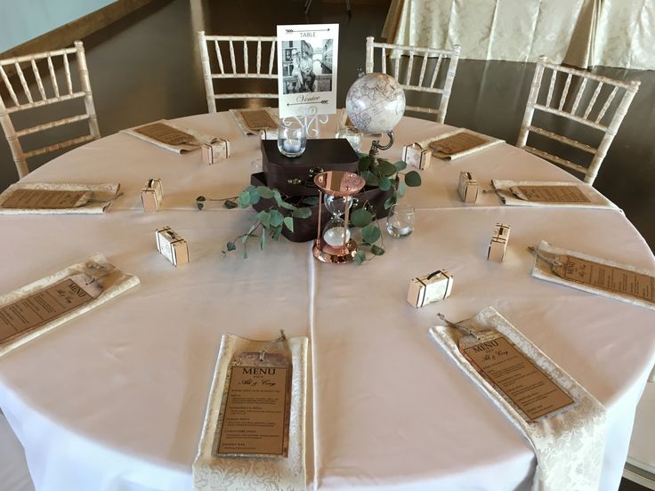 the table is set with place settings for guests