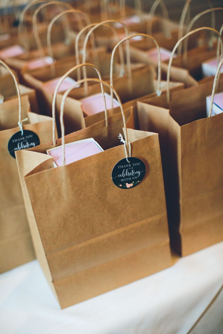 small brown paper bags with tags on them