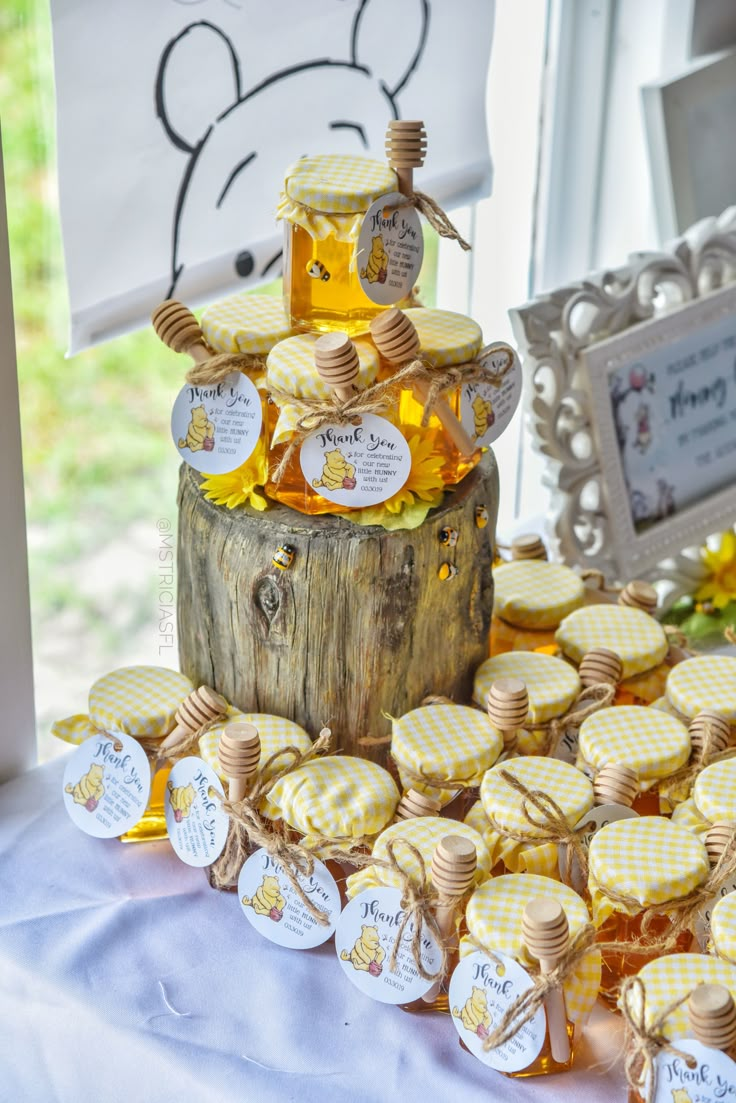 a table topped with lots of cookies covered in honey