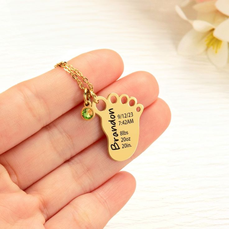 Personalized Birth Stats -  It is a unique keepsake that captures the essence of the baby's birth and creates a lasting memory. This footprint necklace allows the new mom to proudly display her baby's birth details and share the joyous news with family and friends.   Birthstone Detail - The birthstone adds a pop of color and personalization to the necklace, symbolizing the unique identity of the newborn. It enhances the overall aesthetic appeal of the necklace while representing the baby's birth month.  Perfect Gift - The personalized baby birth stats footprint necklace is a perfect Mother's Day gift for a new mom. It commemorates her journey into motherhood and celebrates the precious bond between her and her newborn. The necklace serves as a sentimental reminder of this special phase in Footprint Necklace, Newborn Birth Announcements, Baby Birth Stats, Newborn Birth, Cadeau Baby Shower, Birth Details, Birth Stats, Crochet Simple, Birthstone Pendant