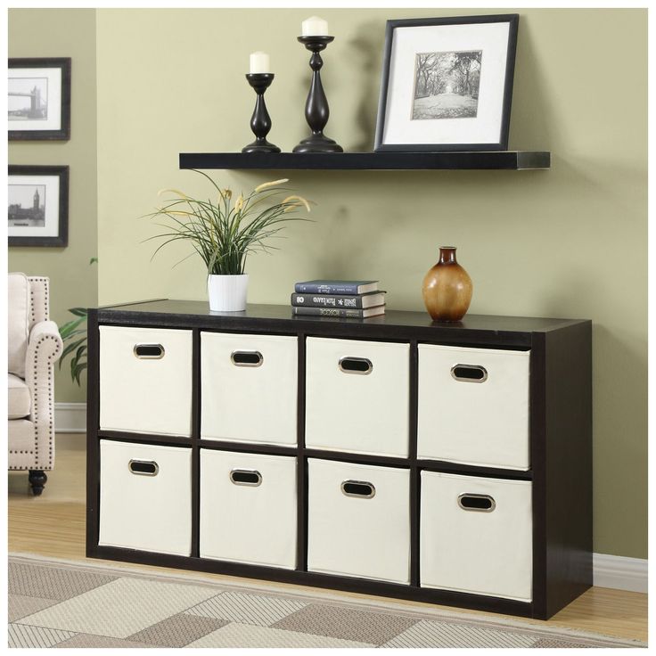 a living room with a white and black cabinet