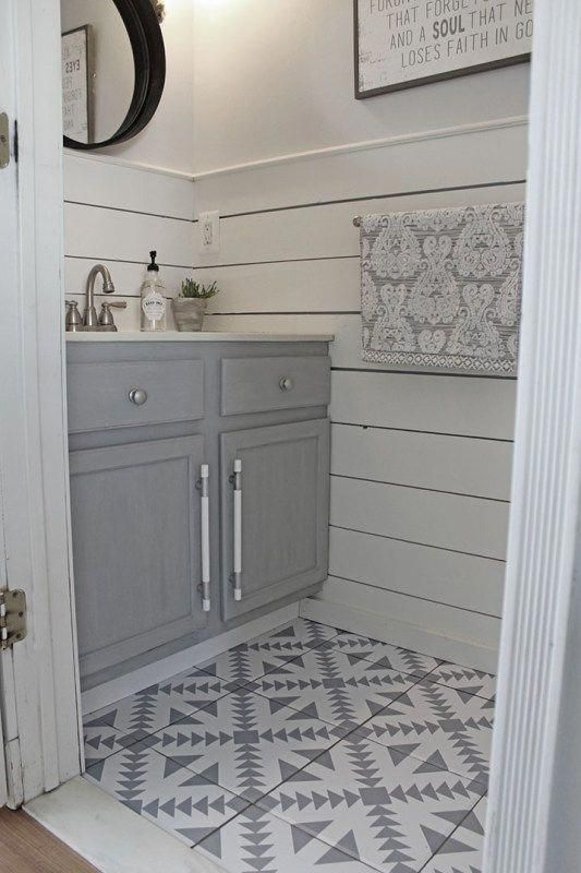 Patterned tile flooring, shiplap wainscoting, shades of grey 