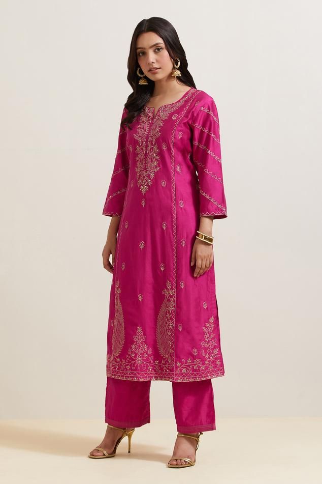 Pink natural weaves chanderi silk kurta with contrast paisley and floral embroidery. Comes with pant and shimmer organza dupatta.
Components: 3
Pattern: Embroidered
Type Of Work: Floral and Paisley
Neckline: Notched
Sleeve Type: Three Quarter
Fabric: Chanderi Silk, Shimmer Organza
Color: Pink
Other Details: 
Embroidered hem pant
Fringed border dupatta
Occasion: Puja - Aza Fashions Tussar Silk Palazzo Set With Resham Embroidery For Eid, Semi-stitched Cutdana Raw Silk Kurta, Eid Tussar Silk Palazzo Set With Resham Embroidery, Transitional Slub Silk Traditional Wear With Zari Work, Traditional Slub Silk Palazzo Set With Resham Embroidery, Transitional Art Silk Kurta With Cutdana, Slub Silk Kurta With Cutdana For Diwali, Designer Slub Silk Kurta With Resham Embroidery, Slub Silk Kurta With Zari Work In Traditional Drape