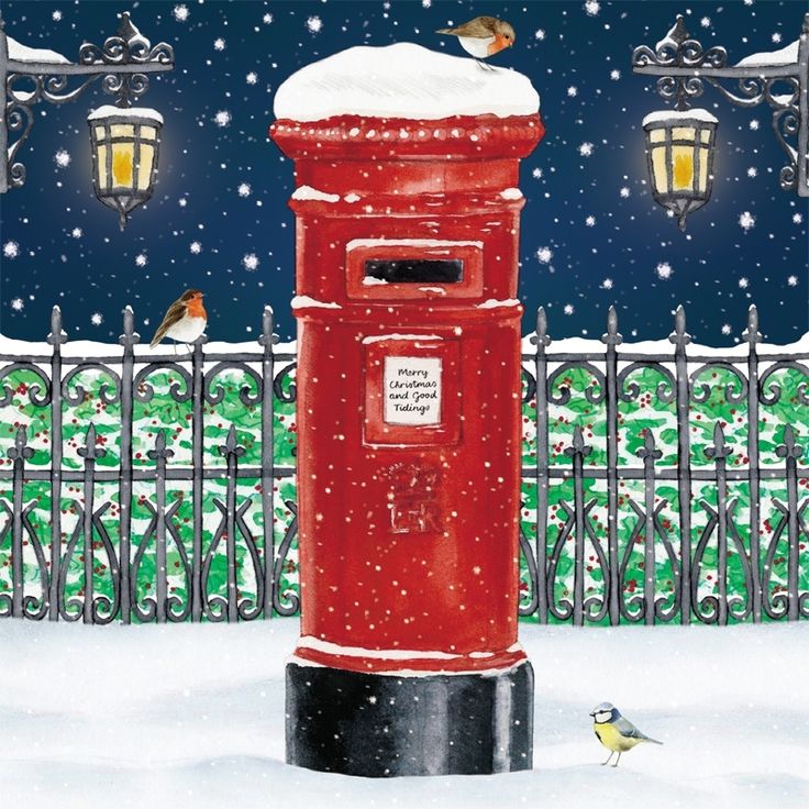 a red mail box sitting in the snow next to a fence and bird on top of it