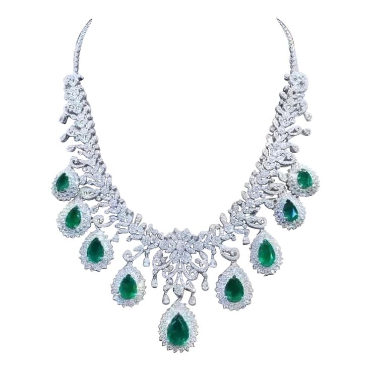 A true piece of art. The intricate design, meticulous craftsmanship, and flawless finishing combine to create a stunning piece that is not only beautiful , but also a work of art , absolutely sophisticated and impressive design. Every detail has been carefully considered, making it a masterpiece of jewelry . Magnificent necklace come in 18k gold with 9 pieces of Natural Zambian Emeralds, spectacular vivid green, extra fine quality and grade , in perfect pear cut, of 25,80 carats, and 1202 piece Opulent Round Necklaces For Formal Occasions, Opulent Formal Necklaces With 17 Jewels, Exquisite Jeweled Emerald Necklace For Anniversary, Luxury Hand Set Emerald Necklaces, Luxury Hand-set Emerald Necklaces, Luxury Teardrop Emerald Necklace With 17 Jewels, Green Diamond Necklace For Formal Occasions, Opulent Formal Necklace With Elegant Design, Pear-shaped Emerald Necklace For Formal Events