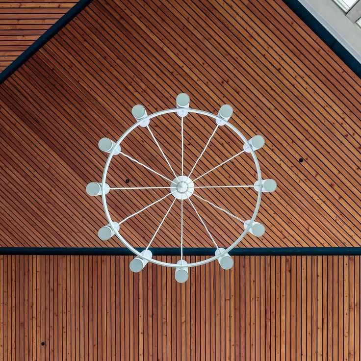 an overhead view of a ferris wheel on a wooden wall and ceiling with wood paneling