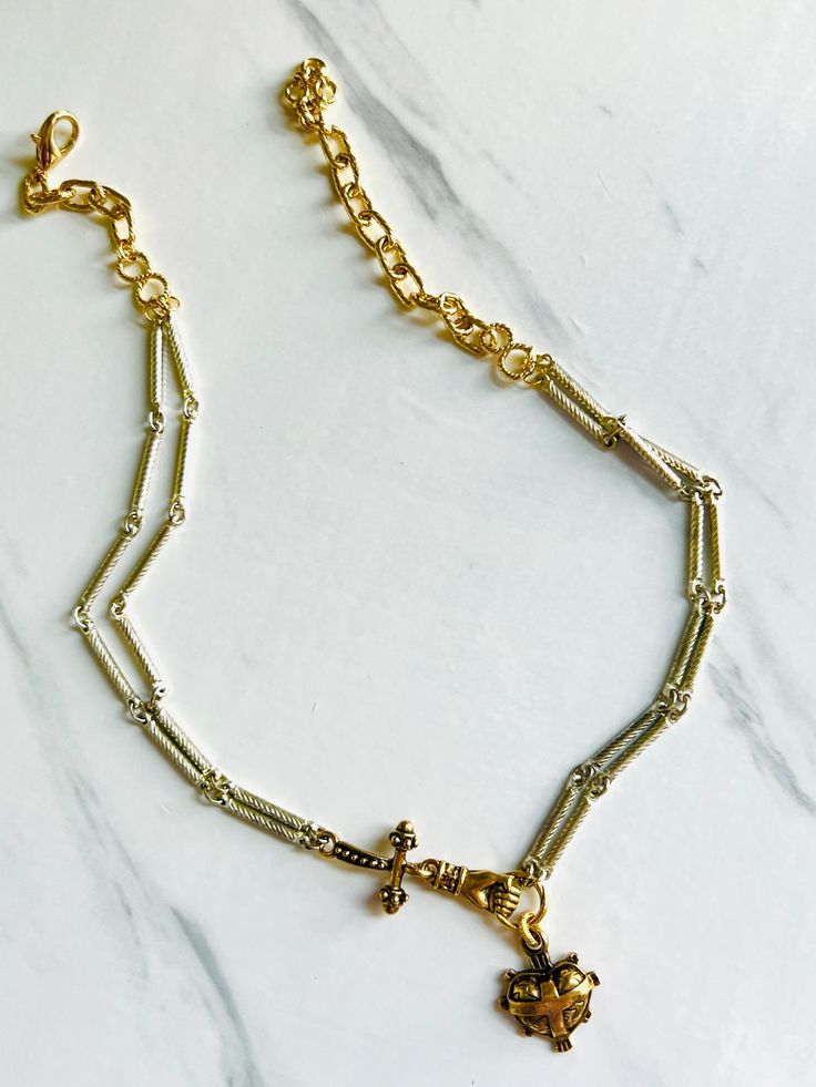 Double strands of textured silver plated bar chain with contrasting brass and gold hardware will light your stack on fire 🔥💛👑 Lobster clasp closure, can be worn at 16” or up to 18”. Free from cadmium, lead, and nickel. Silver Chain Link Necklace In Brass, Silver Brass Chain Link Necklace, Silver Brass Chain Necklace With Delicate Chain, Brass Chain Link Necklace With Lobster Clasp, Metal Chain Necklace With Rectangular Links And Lobster Clasp, Gold Double Strand Necklace With Lobster Clasp, Gold Double Strand Jewelry With Lobster Clasp, Double Strand Metal Chain Necklace With Lobster Clasp, Metal Double Strand Chain Necklace With Lobster Clasp