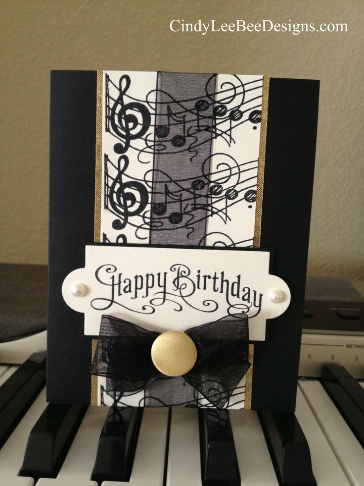 a happy birthday card with music notes on it