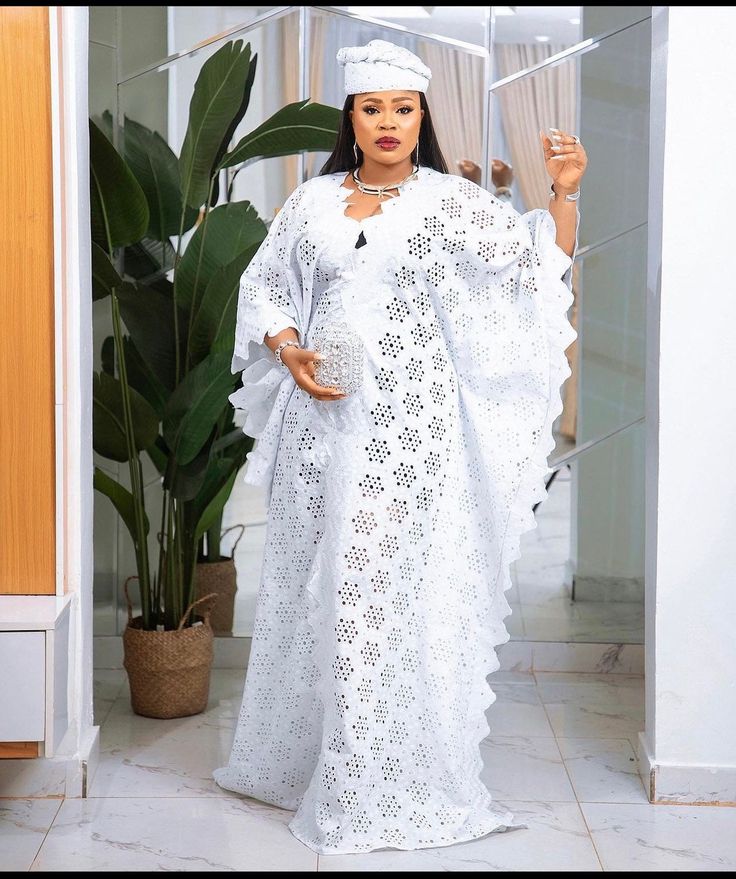 Boubou lace gown White Lace Boubou Styles For Women 2022, Lace Butterfly Bubu Gown Styles, Dry Lace Bubu Gown Styles Nigerian, Boubou Styles For Women Lace, Elegant White V-neck Thobe, Elegant Long Dress With Lace Work, Elegant Long Dress With Lace Patchwork, Long Lace Dress With Lace Work, White Maxi Length Dress With Lace Work