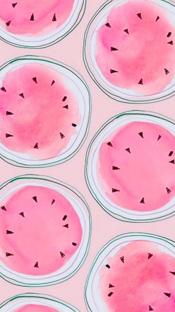 watermelon slices are arranged in rows on a pink surface with black dots around them