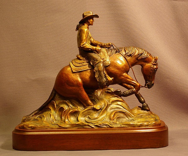 a statue of a man riding a horse on top of a wooden stand with a white background