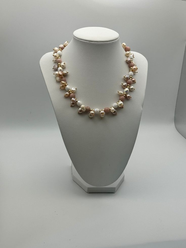 If you're in search of a timeless necklace, your search ends here. Consider the everlasting elegance of pearls - ideal for every occasion, be it anniversaries, weddings, formal events, a spring afternoon ensemble, or a night out. This particular piece promises to surpass your expectations. This necklace is an exquisite composition of delicate blush tones and creamy whites, designed to add a touch of feminine elegance to any outfit. It features an array of pearls and semi-precious stones in soft Elegant Party Beaded Necklace With Pearl Pendant, Elegant Beaded Necklace With Pearl Pendant For Party, Formal Pearl Necklace With Polished Beads, Elegant Akoya Pearl Beaded Necklace For Gift, Elegant Necklace With Pearl Drop And Round Beads, Luxury Pearl Necklaces With Round Beads, Elegant Akoya Pearl Beaded Necklace As Gift, Formal Polished Pearl Necklace, Classic Polished Pearl Necklace For Wedding