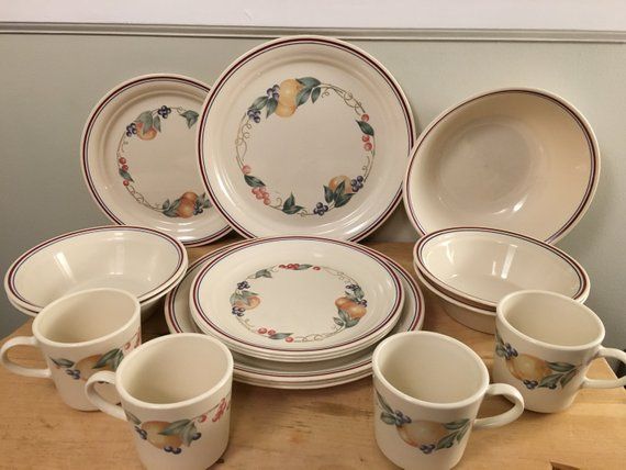 a table topped with lots of plates and cups