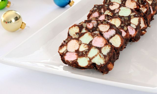 a white plate topped with chocolate and marshmallows