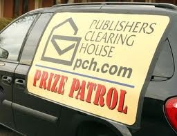 a black car with a yellow sign on it's back door that says, polishers clearing house pick - up