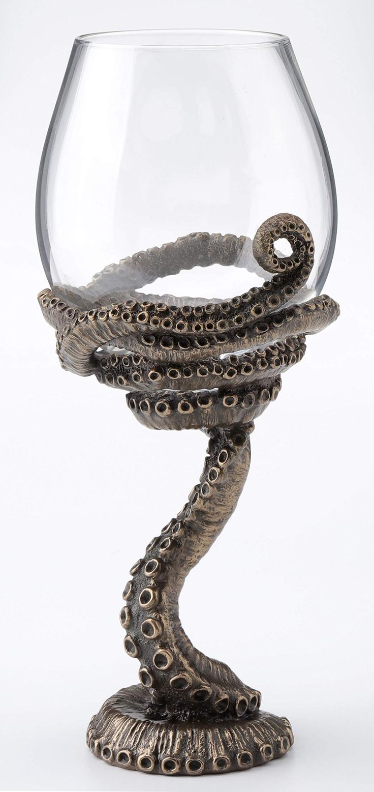 a glass with an octopus in it