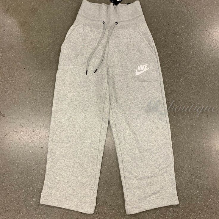 NWT Nike CI1174-050 Women's Sportswear Rally Sneaker Pants Standard Fit Grey XS Details: 100% Authentic Style number: CI1174-050 Color: Grey Size: X-Small Material: 58% cotton / 25% rayon / 17% polyester Wide elastic waistband with exterior drawstring Side hand pockets for quick storage Standard fit Please consider the size chart on picture #10 and #11 as a reference  Size approximately: waist -12.5" one side; pant length - 37"; inseam - 24" MFSRP: $65 + tax About Us: Thank you for your interest Athleisure Gray Pants With Ribbed Waistband, Sportswear Sweatpants For Sports, Gray Sporty Bottoms With Comfort Waistband, Gray Sporty Pants With Comfort Waistband, Sporty Gray Bottoms With Comfort Waistband, Casual Athletic Heather Activewear For Sports Season, Sporty Gray Pants With Comfort Waistband, Cotton Cargo Pants For Sports, Wide Leg Sportswear Joggers With Elastic Waistband