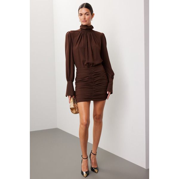 Brown satin (100% Polyester).Blouson. Long sleeves. Mock neck. Back zipper closure. 32" from shoulder to hemline. Imported. Chic High Neck Ruched Mini Dress, Elegant High Neck Ruched Mini Dress, High Neck Ruched Dress For Fall, Fitted Mini Dress With Lantern Sleeves For Fall, Elegant Turtleneck Mini Dress For Spring, Elegant Brown Puff Sleeve Dress, Formal Mini Dress With Lantern Sleeves For Fall, Fall Mini Dress With Lantern Sleeves For Date Night, Fall Mini Dress With Gathered Sleeves