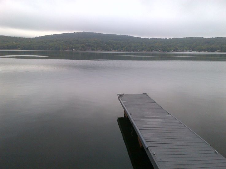 a dock sitting in the middle of a large body of water