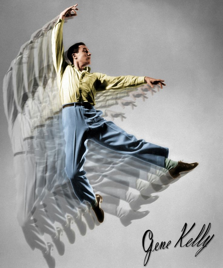 a man flying through the air while holding onto an angel wings like body in front of him