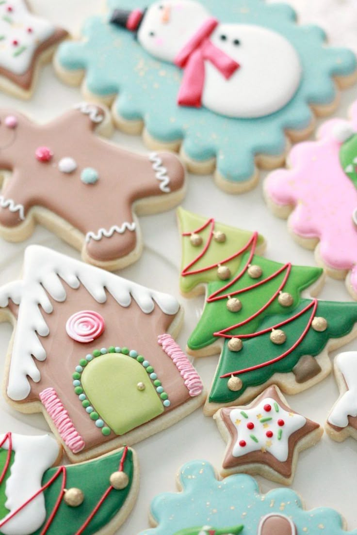 many decorated cookies are on a table