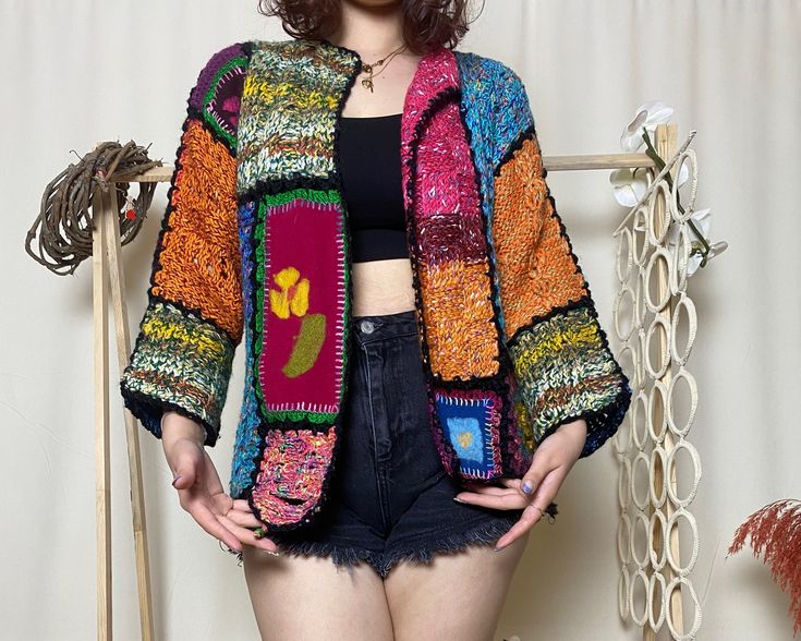 Hey there, beautiful soul! Embrace boho chic with our Handmade Boho Granny Square Crochet Cardigan! This multicolor patchwork floral jacket blends vibrant hues in a short hippie style. Lovingly crafted by artisans, it's the perfect cozy yet trendy knitwear addition to any wardrobe. Elevate your look with unique, handmade charm! ATTENTION Size: Small / Medium / Large Competible Welcome to our exclusive sample product discount! Presenting a unique and exquisite item crafted with love and meticulou Bohemian Spring Outerwear With Multicolor Embroidery, Bohemian Multicolor Outerwear For Spring, Bohemian Fall Festival Sweater, Fall Festival Outerwear With Boho Collar, Vintage Patchwork Sweater For Spring, Spring Vintage Patchwork Sweater, Handmade Bohemian Spring Cardigan, Bohemian Multicolor Long Sleeve Cardigan, Bohemian Long Sleeve Multicolor Cardigan