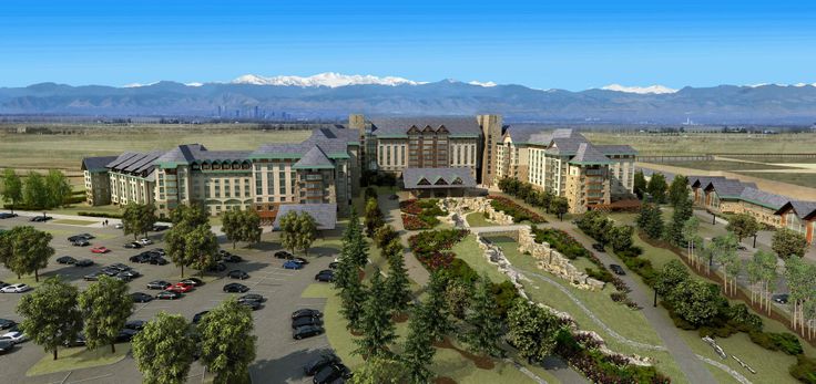 an aerial view of a large building in the middle of a parking lot