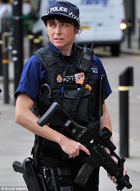 British Police (Manchester) I think she is a bit I amiffed abouts something hhmmm.  Those eyes say it all..  & she has got the puck in gun.  Runnnnnnnn.... Met Police, Tactical Women, Uk Military, British Police, Female Police Officers, Army Police, Female Cop, Special Force, Gods Girl