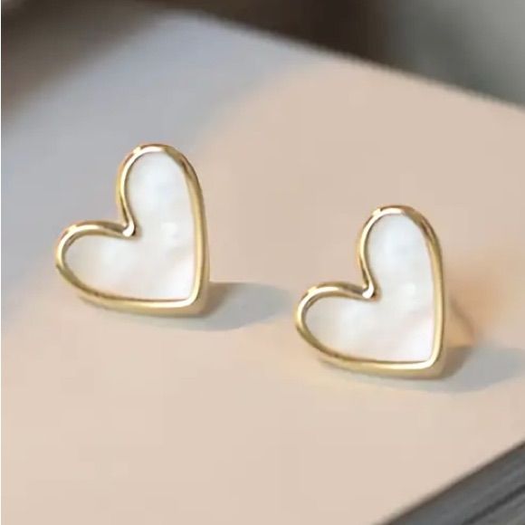 Beautiful Swirly White Tilted Heart Gold Toned Stud Earrings. Playful And Fun! Also Available In Red. See My Other Listings For More Jewelry. Bundle And Save On Shipping. E243 Trendy White Heart Earrings Gift, Trendy White Heart Earrings For Gift, Trendy White Heart-shaped Jewelry, White Open Heart Earrings For Anniversary, White Heart Pendant Earrings As Gift, Trendy White Double Heart Jewelry, White Earrings With Heart Charm As Gift, White Heart Pendant Earrings For Gifts, White Open Heart Earrings For Gift