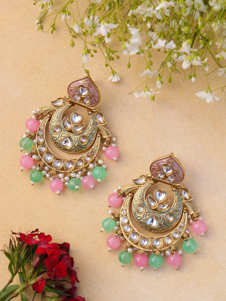 Unleash your inner diva with our mesmerizing Indian Kundan and polki Earrings. Designed to make a bold statement, these earrings exude captivating splendor, blending traditional Indian aesthetics with contemporary allure. Crafted with meticulous attention to detail, these earrings showcase the artistry of Kundan work. The vibrant Kundan stones take center stage, radiating a luminous charm that catches every eye. The intricate setting in gleaming golden tones adds an element of opulence and elevates their allure to new heights. Each earring weighs 22 gms  Length 3 inches  Width 1.5 inches Punjabi Jewelry, Chandbalis Earrings, Jewellery Shoot, Kundan Work, Jewelry Pakistani, Polki Earrings, Chandbali Earrings, Wedding Jewellery, Pakistani Wedding