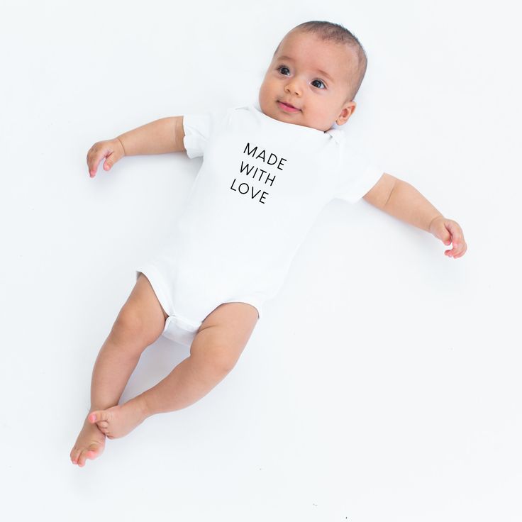 'Made with Love' onesie. For when your little one is crafted together with sugar, spice, and everything nice. 100% organic cotton, printed with baby-safe ink in our studio in sunny Sacramento. Available in infant and toddler tees here. Personalized Cotton Onesie For Playtime, Personalized Cotton Playtime Onesie, Personalized Cotton Onesie, Personalized Unisex Cotton Onesie, Playful Cotton Bodysuit As A Gift, Sugar Spice And Everything Nice, Social Butterfly, Shop Icon, Baby Safe